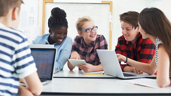 Group of middle school age students working together