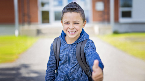 Student  smiling with thumbs up