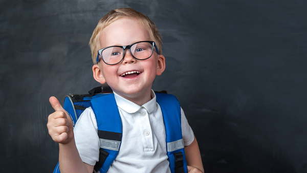 Elementary school age boy with thumbs up