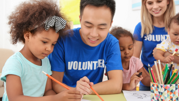 Volunteers working with children