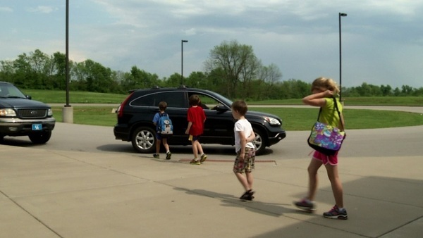 Students going out to a car