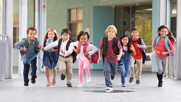 Group of students running towards the camera