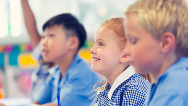 Group students in a class with side view of student  faces.