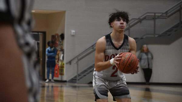 Dover boys basketball player taking a free throw shot