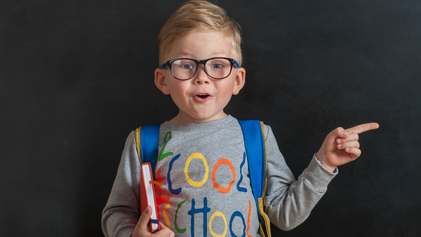 Kindergarten male student pointing