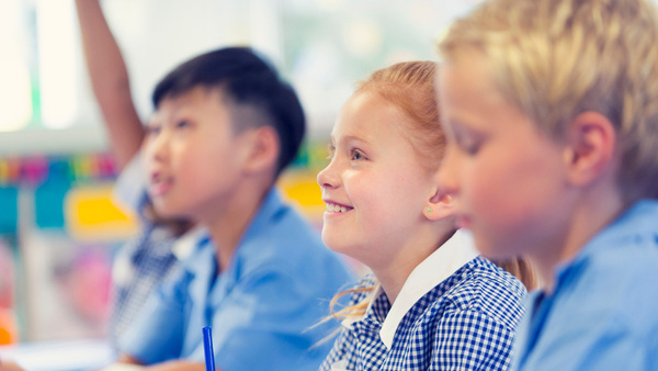 Group students in a class with side view of student  faces.