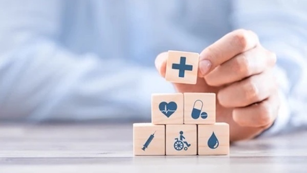 Man's hand with medical symbol blocks