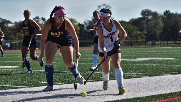 Dover field hockey player in action