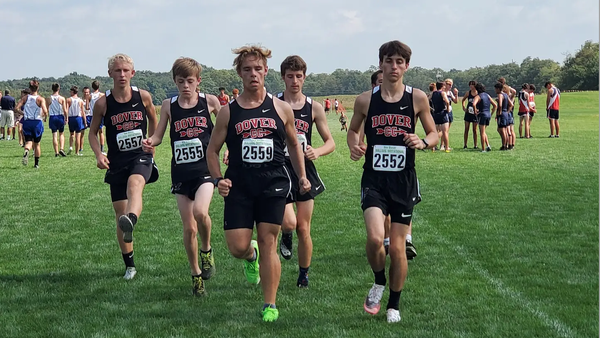 Boys cross country team running towards the camera