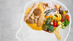 Outline of  a head with food making the brain.