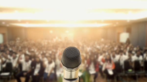 Microphone with blurred out audience