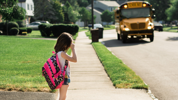 Elementary age student waiting for the bus