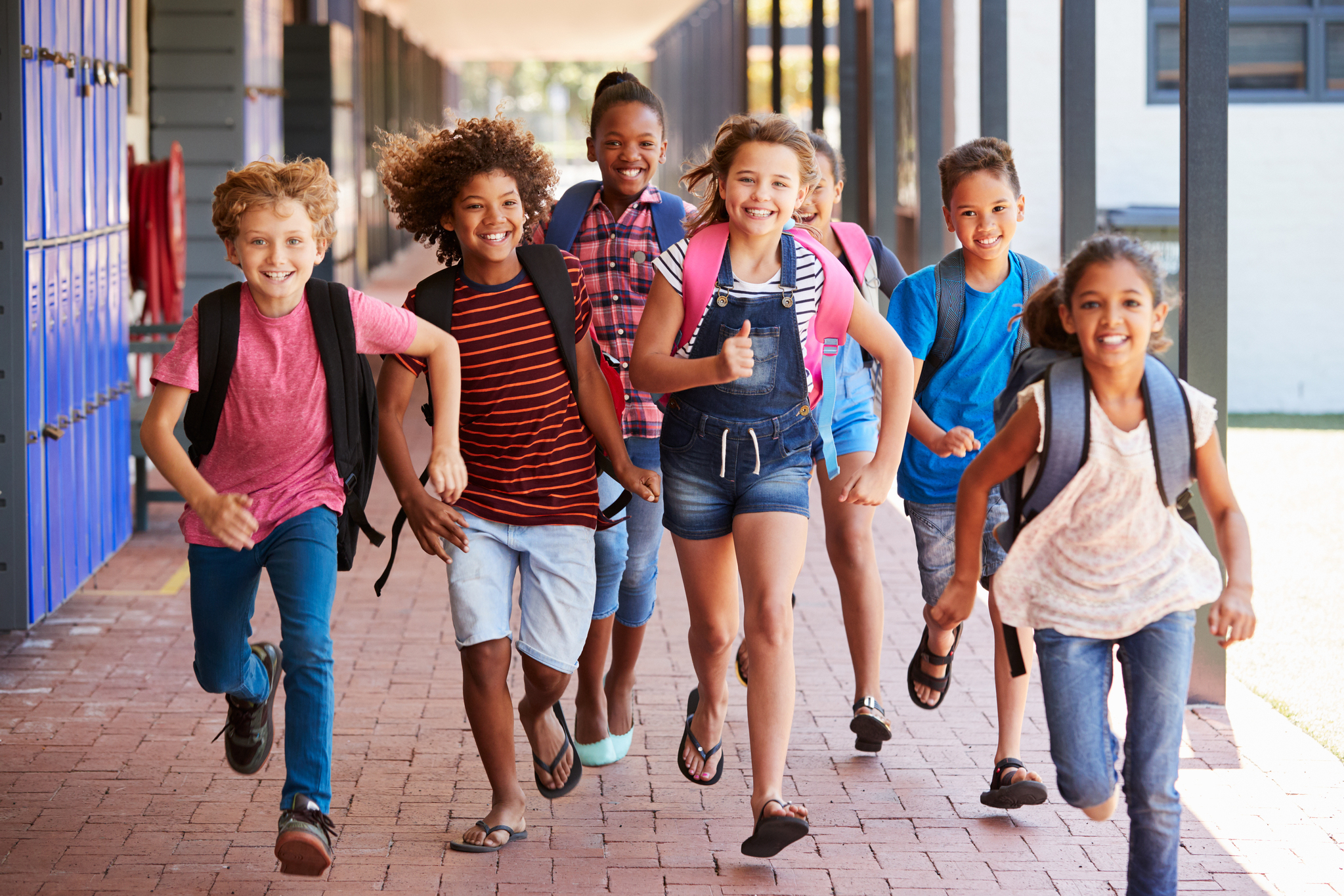 Students running towards camera